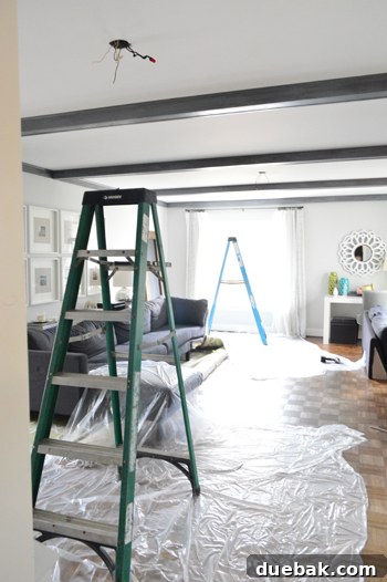 Smart Savings on Electrical Services 2 Elegant living room showcasing new recessed lights and a modern pendant light, illuminating a cozy seating area.