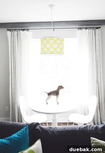 Smart Savings on Electrical Services 14 A modern white pendant light hanging perfectly centered over a table, creating a focal point in the living room.