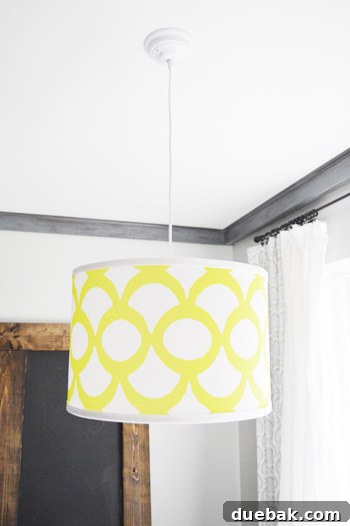 Smart Savings on Electrical Services 15 Close-up of the elegant white pendant light, highlighting its crisp design and seamless integration into the ceiling.
