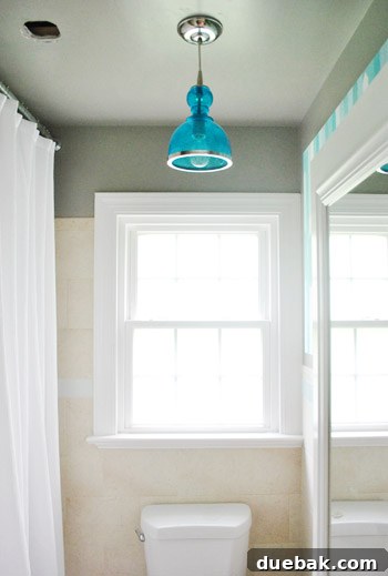 Smart Savings on Electrical Services 7 A previous DIY project showing a bathroom light fixture being centered, demonstrating past experience with similar tasks.