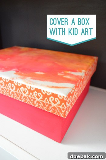 Girl holding a tiny paint brush with a wooden craft box