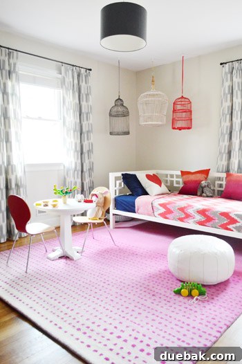Clara's daybed with new navy sheets and heart pillow