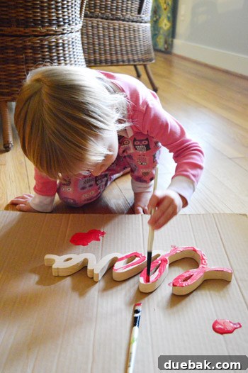 Clara painting her name plaque