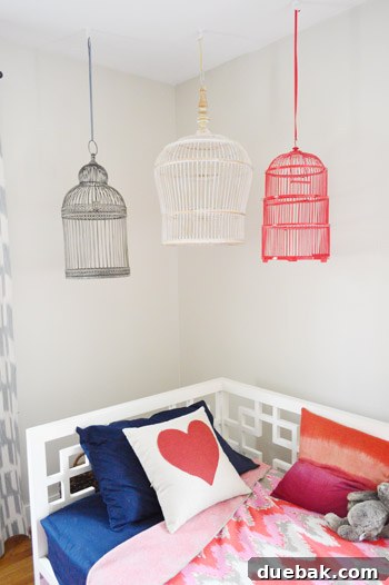 Birdcages on the wall above the daybed