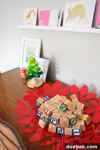 Clara's desk with wooden stacking tree and red bowl with blocks
