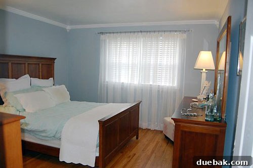 bedroom-two Mid-transformation shot of Erin's master bedroom showing new flooring and initial setup