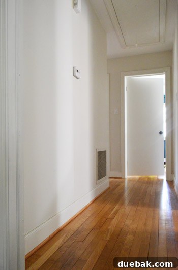 Hallway wall with initial board and batten framework installed