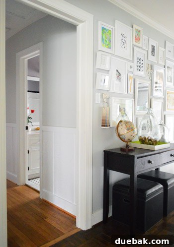 Stylish hallway featuring board and batten with gray walls and white trim