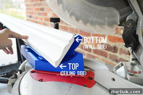 Mastering Crown Molding Installation 14 Crown molding ready for cutting on miter saw with kreg crown pro