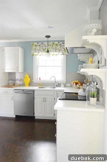 Painting Our Kitchen Soft Blue Colorado Gray 11 Kitchen with blue walls and warm accents