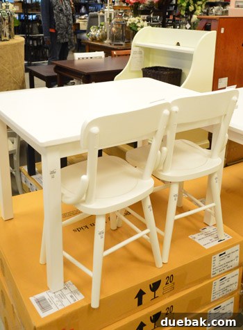 Traditional, cottage-style wooden children's chairs at the outlet