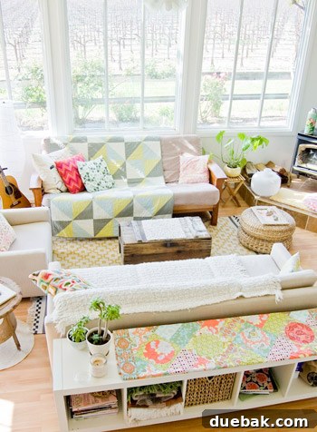 Crashing into Quaintness: The Vine-Covered Home 6 Bright living space with large windows and layered textiles