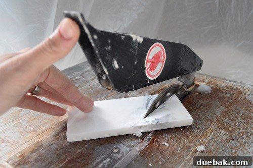 Your Guide to a Stunning Marble Herringbone Fireplace 13 Cutting marble tiles with a wet saw