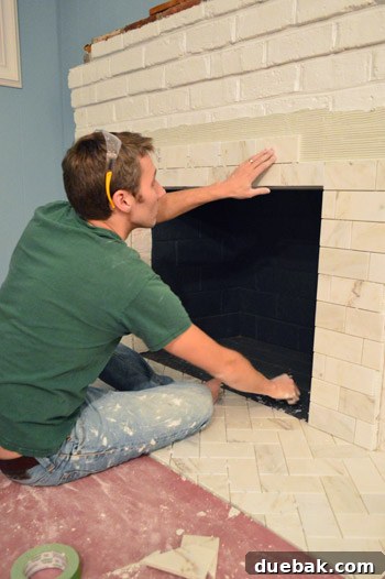 Your Guide to a Stunning Marble Herringbone Fireplace 16 Fireplace surround tiling progress