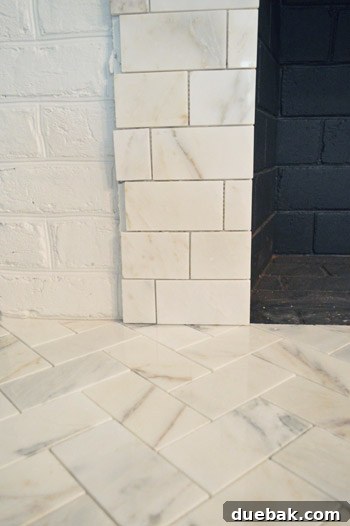Your Guide to a Stunning Marble Herringbone Fireplace 17 Efficient tile staggering technique