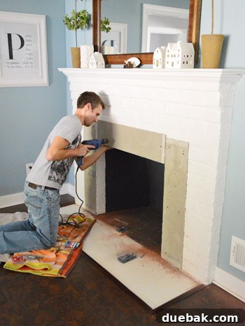 Your Guide to a Stunning Marble Herringbone Fireplace 6 Installing cement board on fireplace
