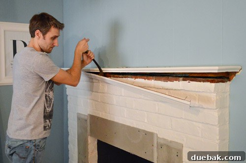 Your Guide to a Stunning Marble Herringbone Fireplace 7 Clearing fireplace mantel before DIY