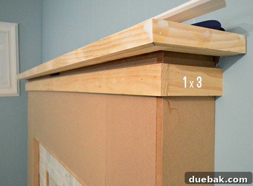 Prepping for crown molding by adding a wood strip to achieve flush alignment