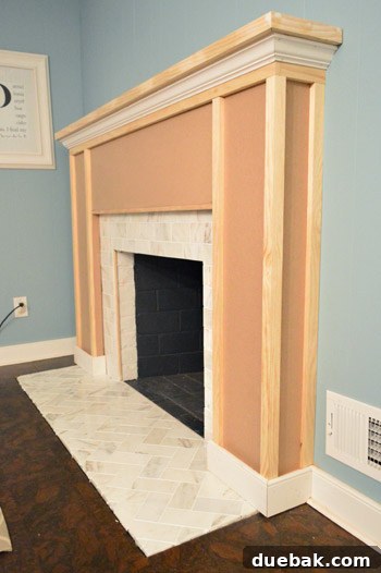 Adding vertical 1x2 strips to begin forming decorative boxes on the fireplace surround