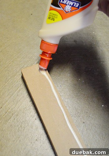 Applying wood glue before fastening MDF pieces for enhanced strength