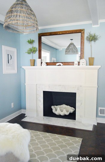 Our $200 Marble Fireplace Glow-Up 11 Beautiful full view of the renovated fireplace as a central feature in the living room
