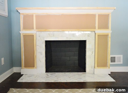 Our $200 Marble Fireplace Glow-Up 3 Fireplace makeover mid-process with new tile and built-out frame