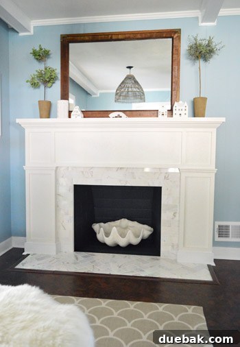 Our $200 Marble Fireplace Glow-Up 8 Detailed shot of the newly installed marble subway tile on the fireplace