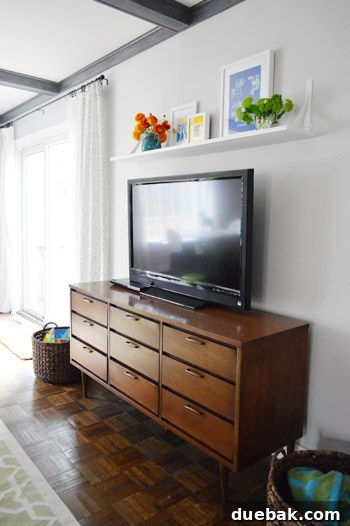 Elevate Your Entertainment Install a Shelf Above Your TV 2 Bare wall above TV before transformation
