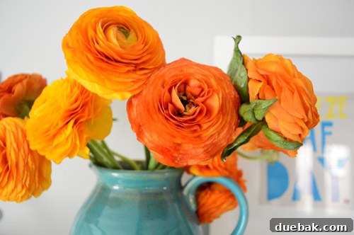 Elevate Your Entertainment Install a Shelf Above Your TV 11 Ranunculus flowers on the shelf