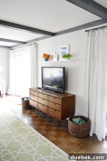 Elevate Your Entertainment Install a Shelf Above Your TV 7 Finished DIY shelf above TV with decorations