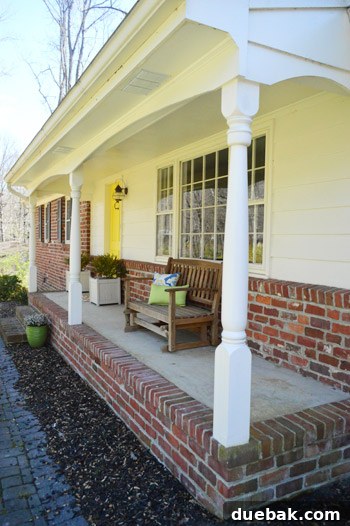 Refreshing Your Porch: Taking Down Scalloped Trim and Repairing Columns 3 Close-up view of the inherited colonial style porch column and curved scalloped header, highlighting the outdated design.