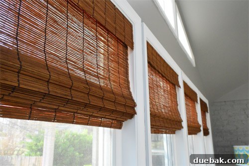 Newly installed bamboo blinds in a sunroom window