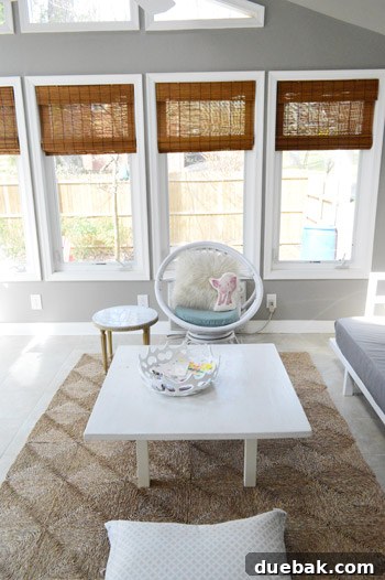 After shot of the sunroom with bamboo blinds, viewed from the living room