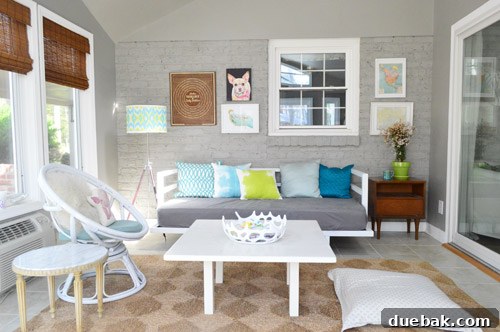 Transformed sunroom with bamboo blinds and updated decor