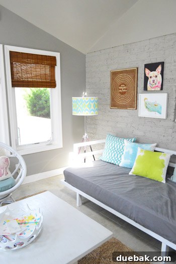 Decorative wooden doily stretcher on a wall next to bamboo blinds
