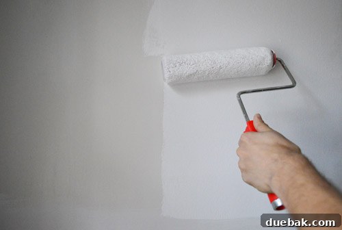 Before and after painting the guest bathroom walls white