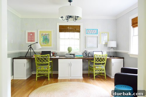 Stylish office with stenciled walls and unique light fixture