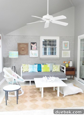 Sunroom showing window treatments and art