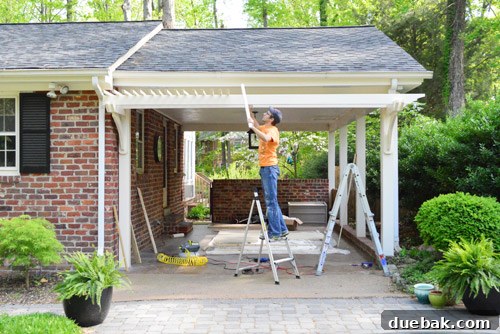 Installing the lath on top of the pergola joists