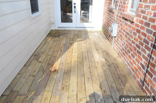 Close-up of dirty deck wood before pressure washing
