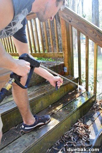 Pressure washing a wooden fence