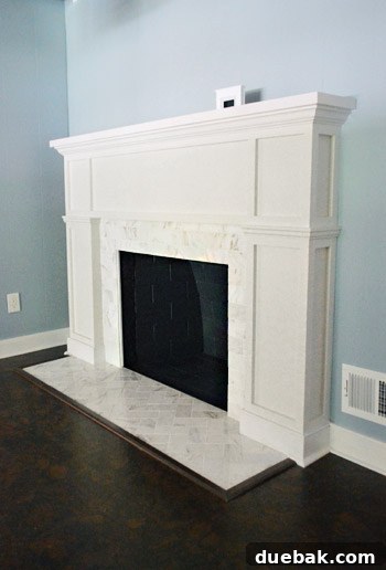 Our beloved fireplace, now recreated in miniature form, perched elegantly on a mantelpiece in our new home.