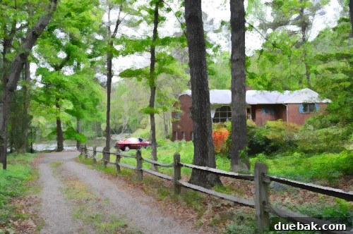 Houses That Almost Became Home 2 The Lake House, a modest home situated by a serene lake with challenging renovation potential.