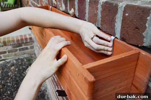 Securing window boxes to brackets