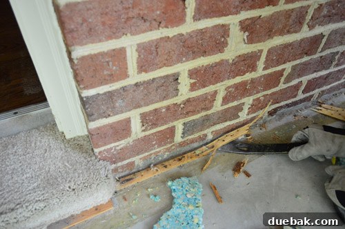 Removing Carpet, Padding, and Tack Strips 5 John removing brittle tack strips from sunroom