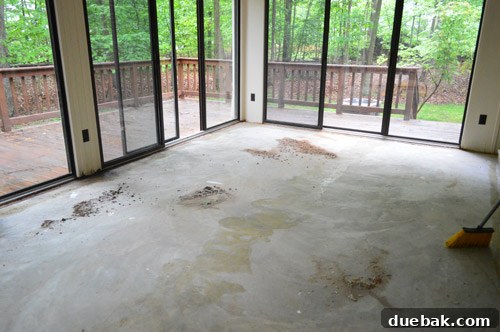 Removing Carpet, Padding, and Tack Strips 6 Cleaning sunroom floor with a shop vac after carpet removal