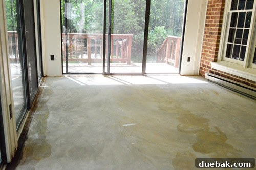 Removing Carpet, Padding, and Tack Strips 8 Close-up of smooth concrete floor with glue stains