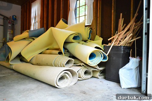 stacks for old carpet rolls ready for removal