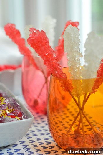 Dragon's Lair Birthday Bash 10 A vibrant display of rock candy, resembling fiery gems, for a dragon-themed birthday party.