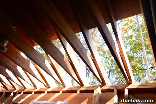 Major Home Upgrades: Furnace and Roof 4 Exposed roof decking during replacement, showing areas of damage and rot.